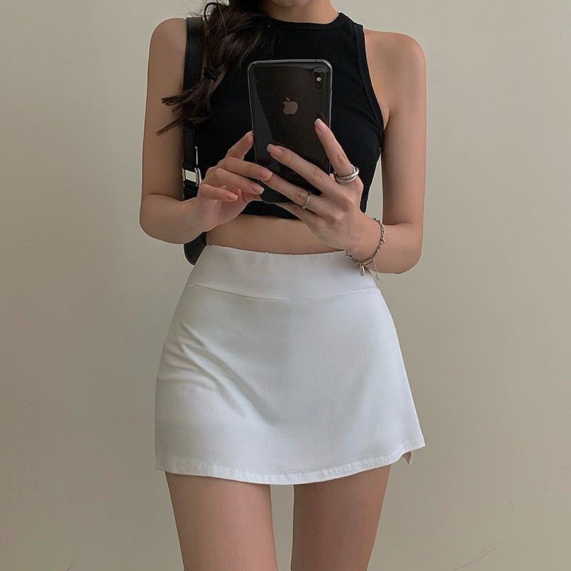 Zurück zum College Tennisrock Damen Hohe Taille Mädchen Enge Tasche Hüfte Kurzer Rock Sommer Sport Culottes Split A-Linie Minirock Y2K 
