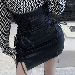Schwarze Leder-Miniröcke für Damen, Gothic, hohe Taille, schmale Passform, Bleistiftrock mit Schnürung, weiblicher sexy Club-Reißverschluss auf der Rückseite, geteilter Hüftrock